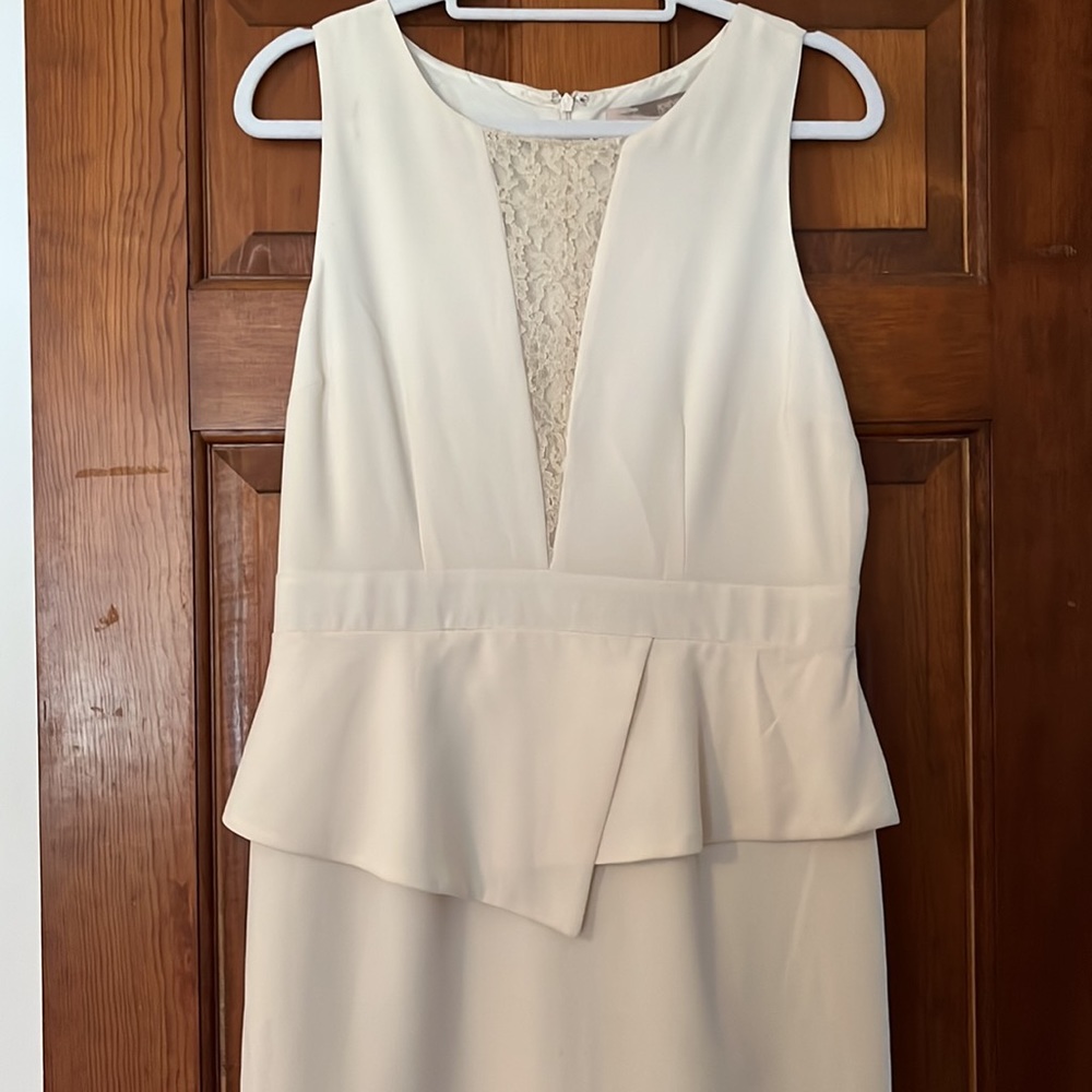 NWT Ivory peplum dress with plunge lace neckline